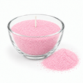 AI-genereret illustration af lyssand i en lysere Rosa med fine stearinkorn